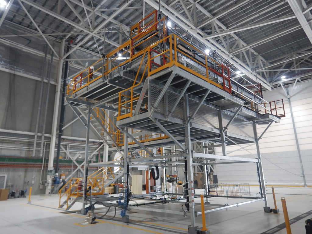 Aircraft tail docking system inside a maintenance facility